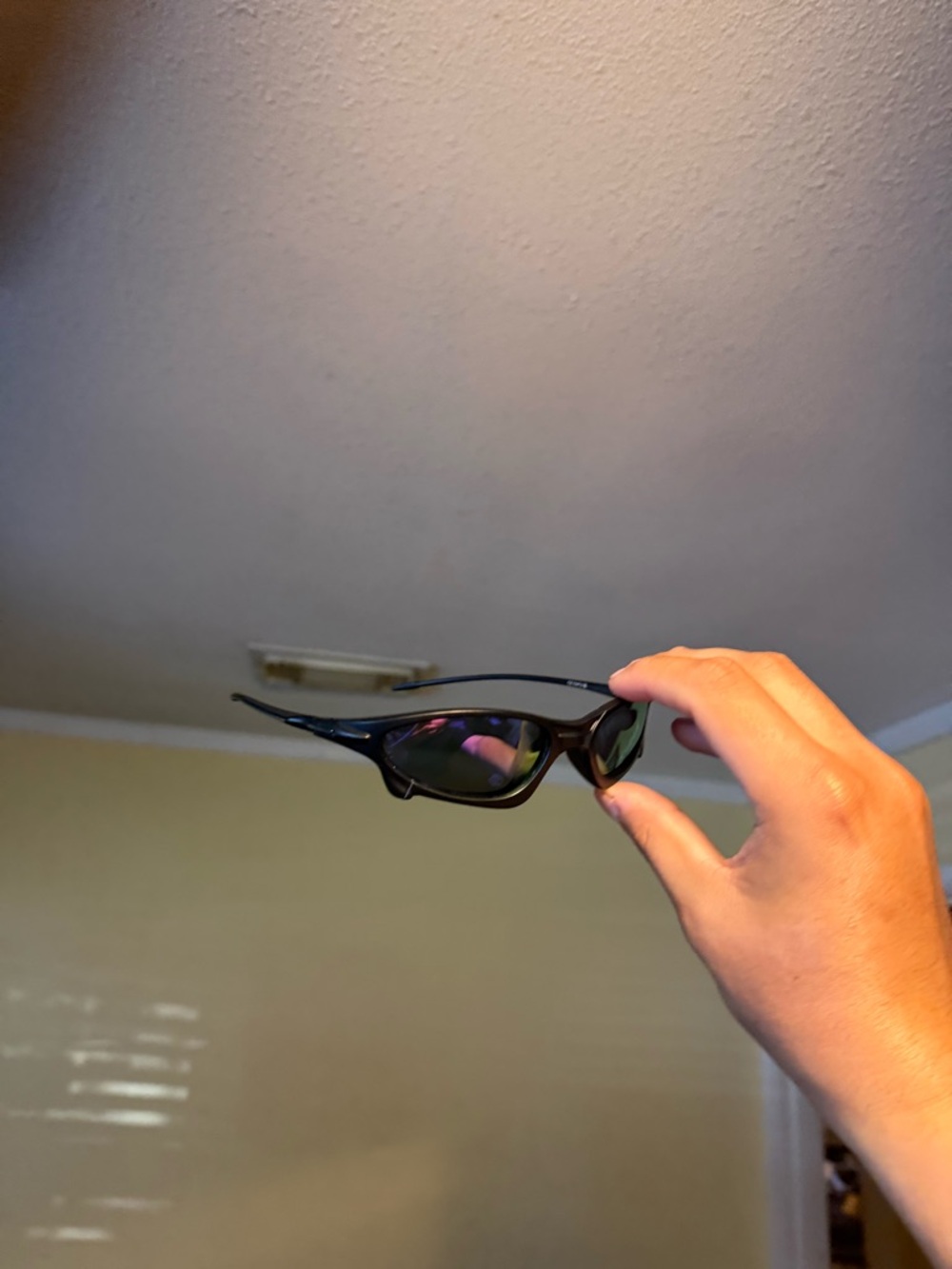Sleek Black Sport Sunglasses with Tinted Lenses Oakley Oakleys